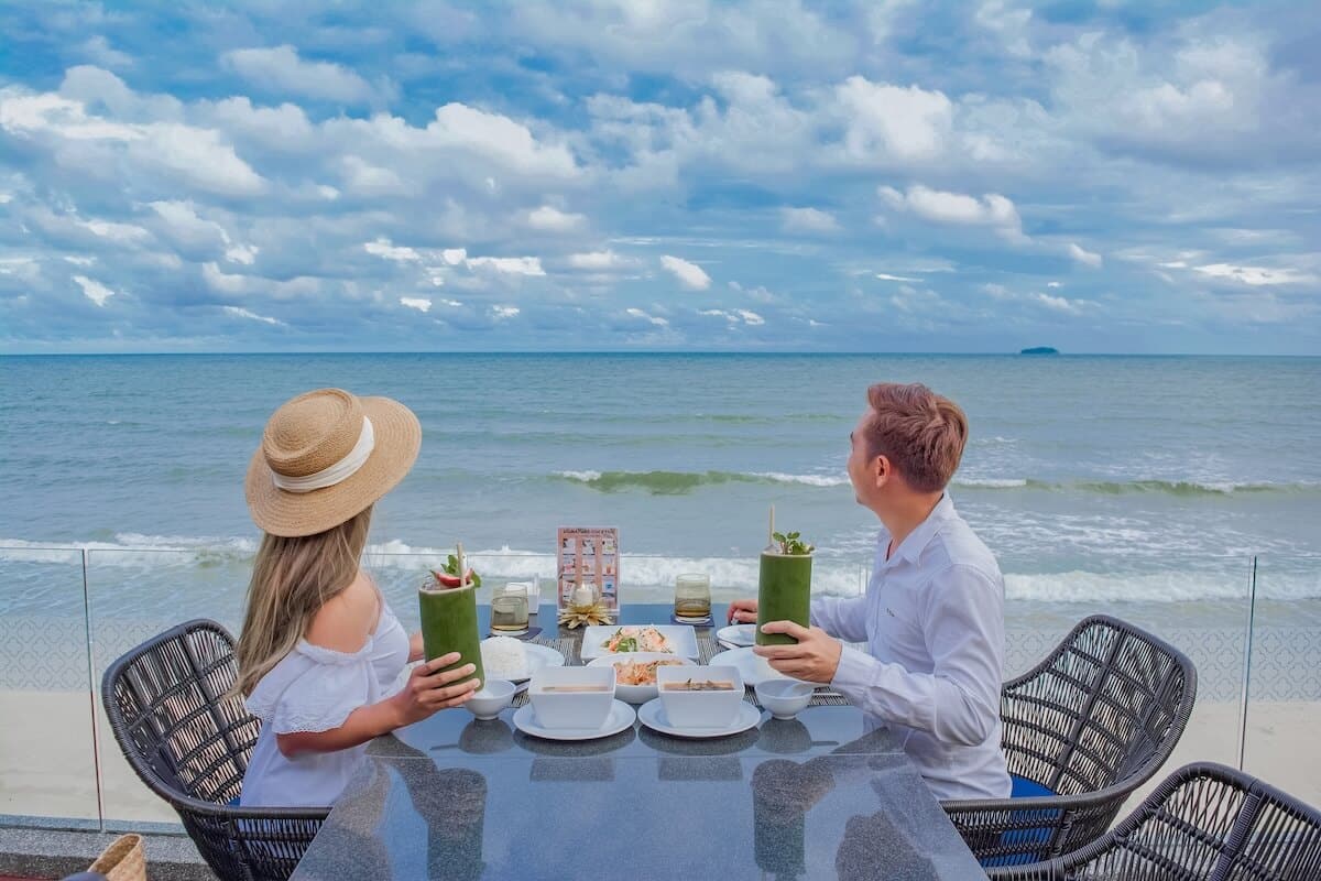 Couple enjoying a beachfront meal